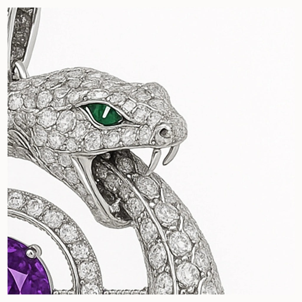 Macro of diamond-pavé ouroboros snake head biting its tail; emerald-green eye; white-gold pendant with amethyst accent.