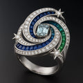 Redbutan Cosmic Vortex high-jewel ring in white gold with aquamarine, calibré sapphires/emeralds and diamond star accents—front three-quarter.