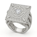 white-gold square pavé signet ring with raised circular mandala, trillion-cut center diamond, and baguette cardinal markers