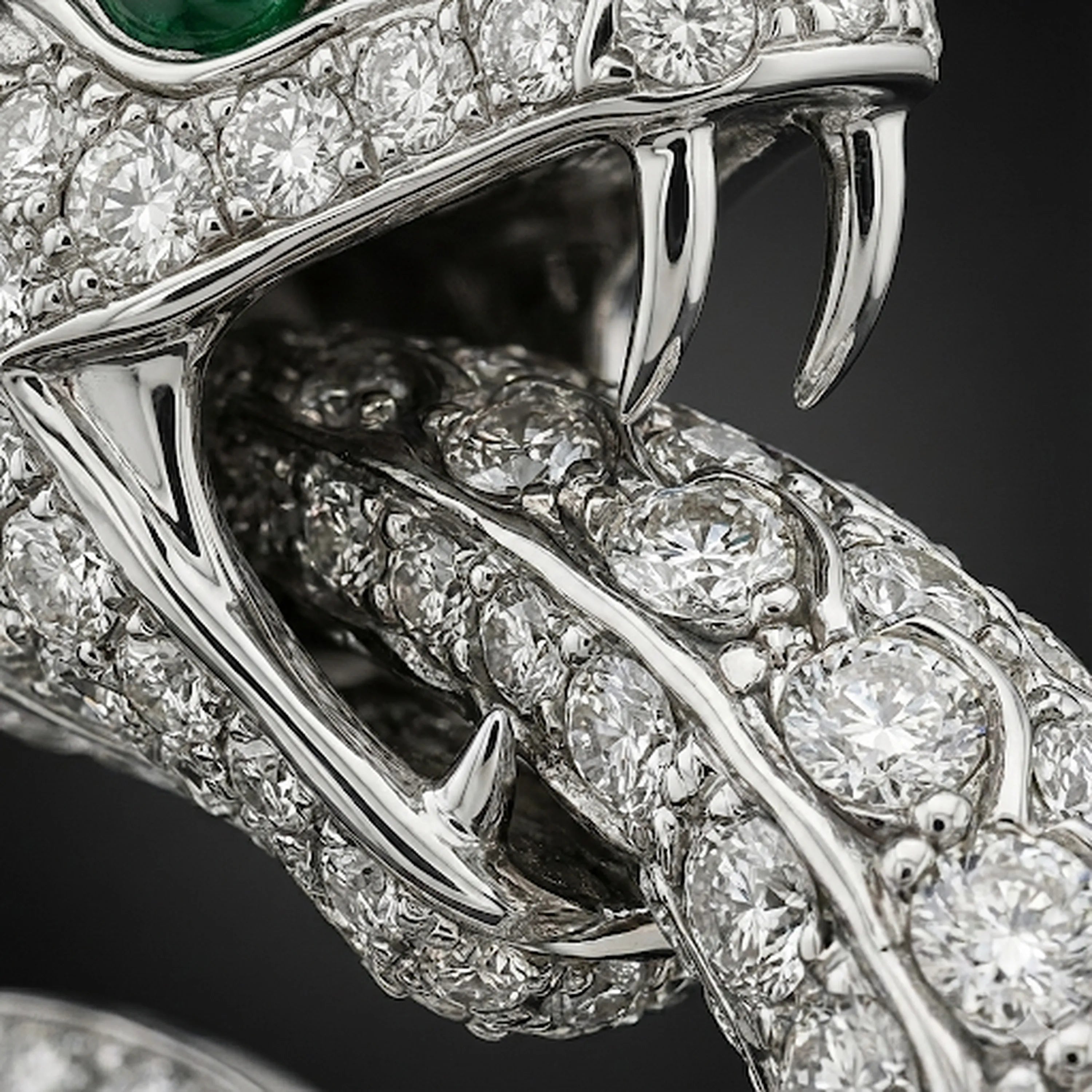 Extreme macro of Redbutan Nebula Ouroboros Serpent showing diamond pavé scales and sculpted fangs with high-precision setting detail.